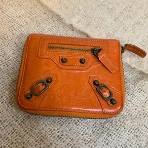 Balenciaga City Wallet orange.  Many pockets.